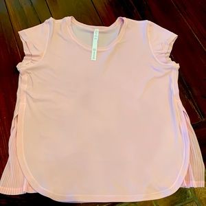Lululemon size 10 baby pink shirt with pleated on the side super cute